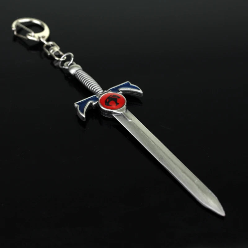 Silver metal sword keychain featuring a lion mark design with blue and red accents