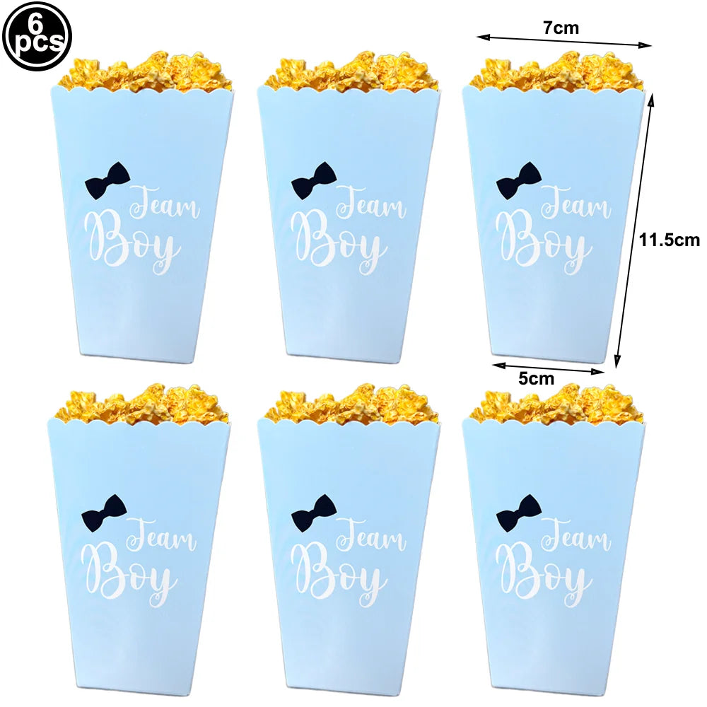 Six blue aluminum foil baby bottle balloons with black bow decorations and size measurements