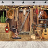 A rustic western backdrop featuring a wooden barn door, leather goods, and a horse head.