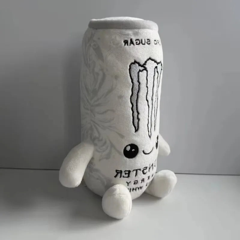 A soft plush toy shaped like an energy drink can, white with black text and a striped design.