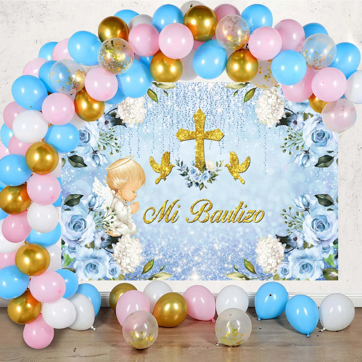A floral and gold balloon arch backdrop for a baptism or communion celebration
