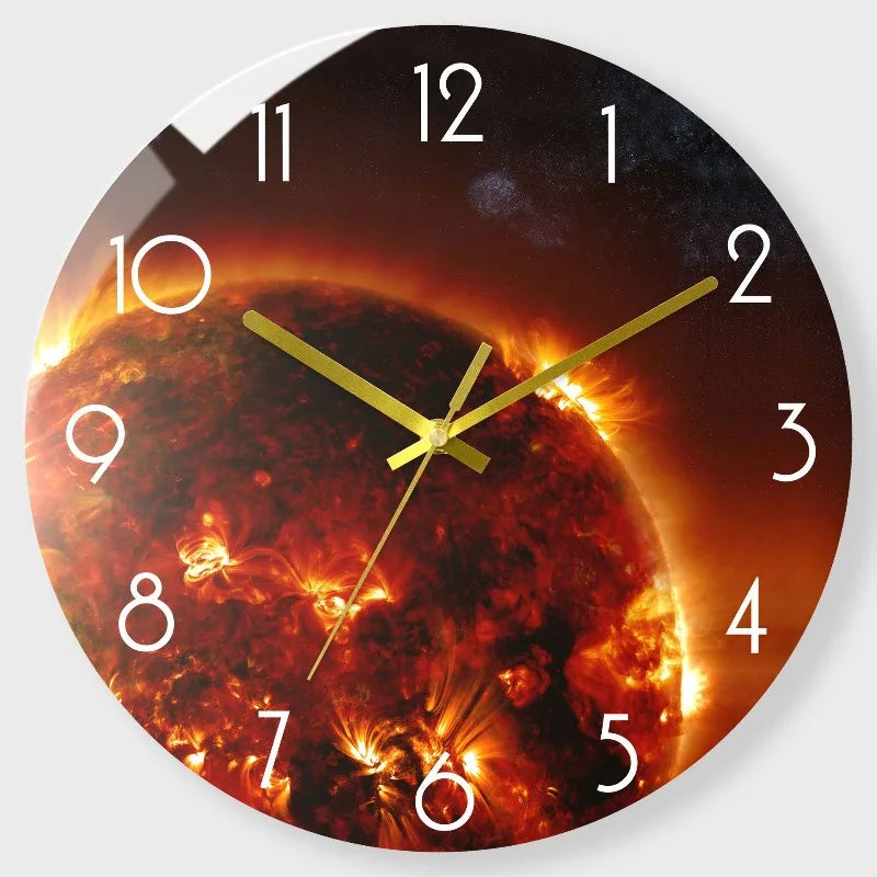 A round clock face showing a fiery solar eclipse effect with a dark background and golden hands.