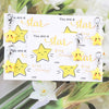 A set of inspirational star keychains featuring yellow and gold stars on white cards.