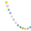 A string of colorful felt balls in yellow, pink, and teal used for home decor.