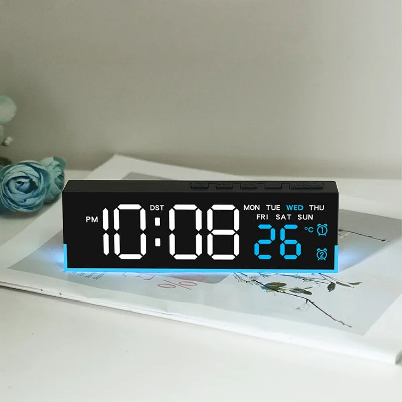 A digital LED alarm clock displaying 10:08 PM, with a temperature of 26 degrees Celsius.