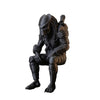 A dark sci-fi figurine of a hunter character in armor is shown from the front view.