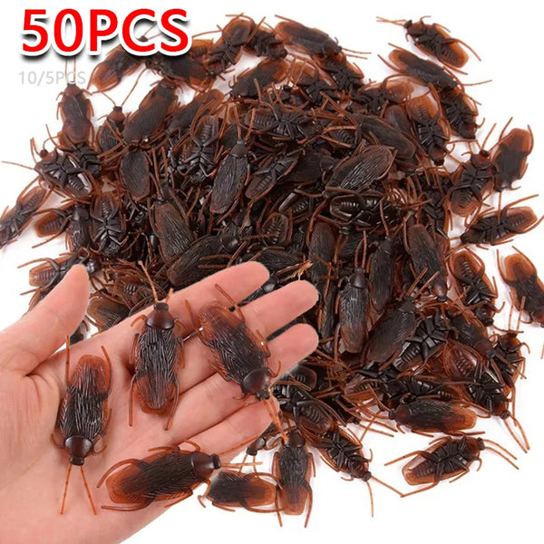 A pile of realistic plastic bugs including cockroaches, centipedes, and scorpions for Halloween pranks.