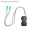 A black wire with two green LED eyes and a separate control module for an electronic decoration.