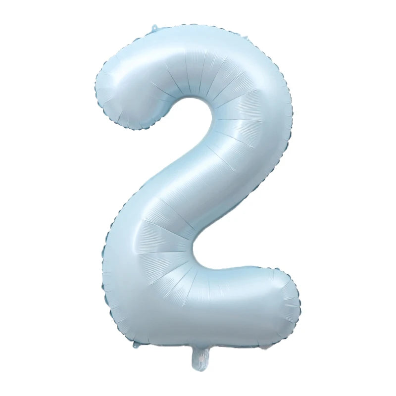 A light blue foil number balloon shaped like the number 2.