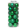 A clear plastic box containing 24 green festive Christmas tree ornament balls.