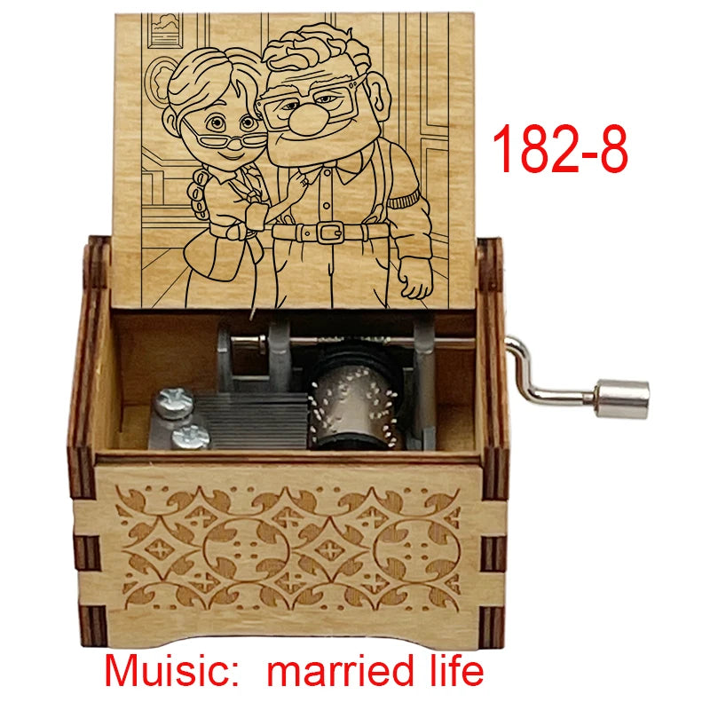 A wooden music box featuring a line drawing of a couple, with a crank mechanism and decorative wood carving.
