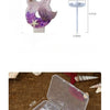 Purple mermaid tail shaped birthday candles decorated with starfish and flower on a clear plastic tray