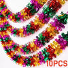 Three strands of shimmering tinsel garland ribbon in red green and gold for holiday decor