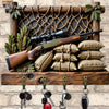 A vintage wooden key hook set displayed on a rustic wooden rack against a stone wall.