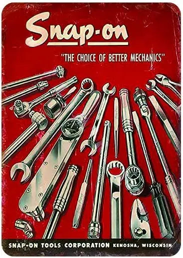 Vintage metal Snap-On tools decor sign featuring various wrenches and tools on a red background