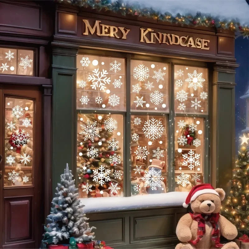 A storefront window decorated with snowflake window clings for Christmas holiday display