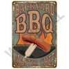 A vintage metal tin sign with distressed paint featuring the text BACKYARD BBQ MASTER CHEF and an illustration of a sizzling 