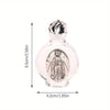 A clear glass bottle containing a religious sculpture of Jesus in an oval frame with a silver cap.