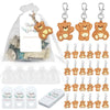 A set of cute bear keychain party favors with organza bags and thank you tags