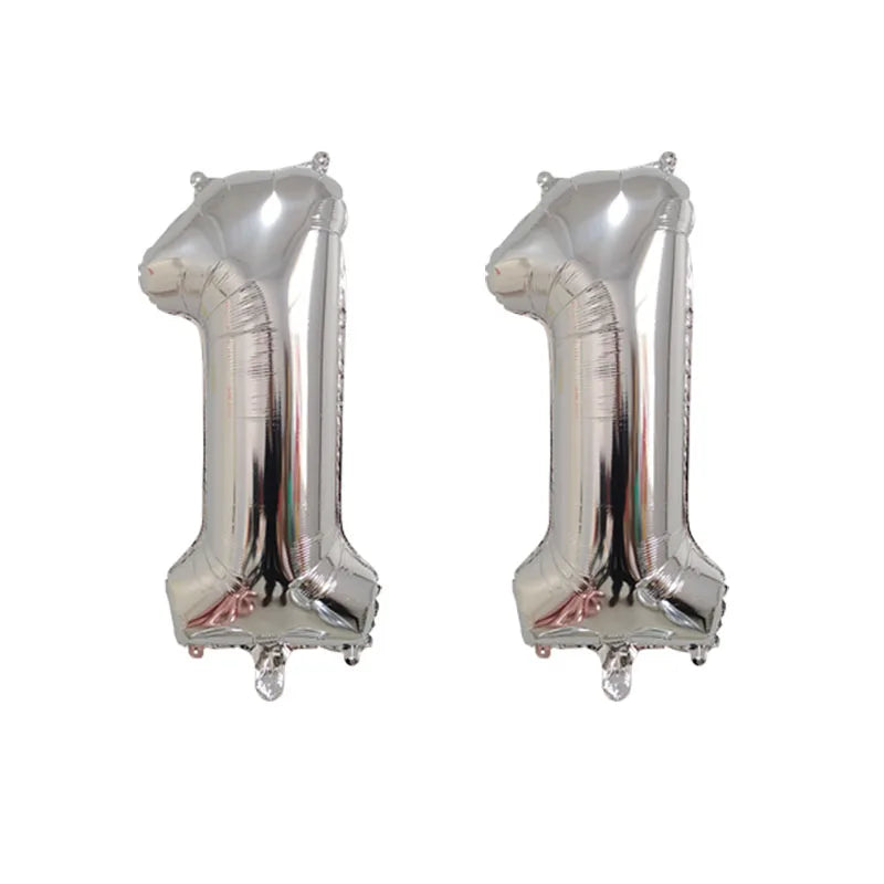 Silver foil number balloon shaped like the number 1, used for birthday party decor