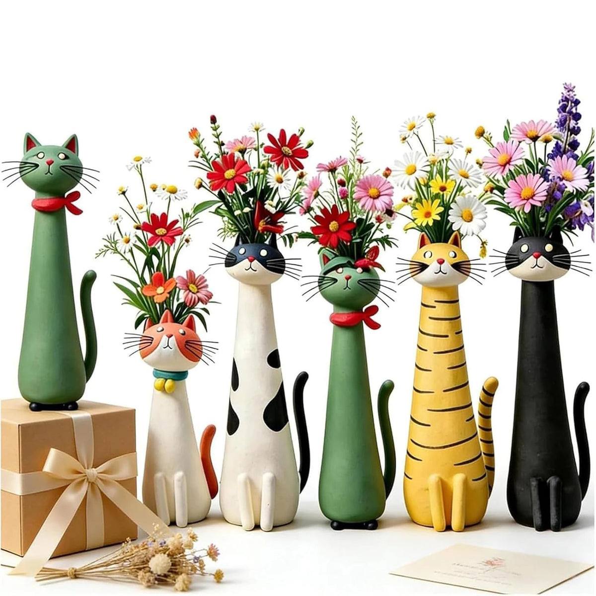 A collection of whimsical resin cat-shaped flower vases in various shades of green, black, and yellow.