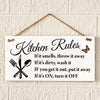 A white wooden sign with black text listing kitchen rules such as throwing away smelly items and turning off appliances.