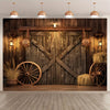 A rustic wooden backdrop featuring a weathered barn door design with decorative lighting and vintage wagon wheels.