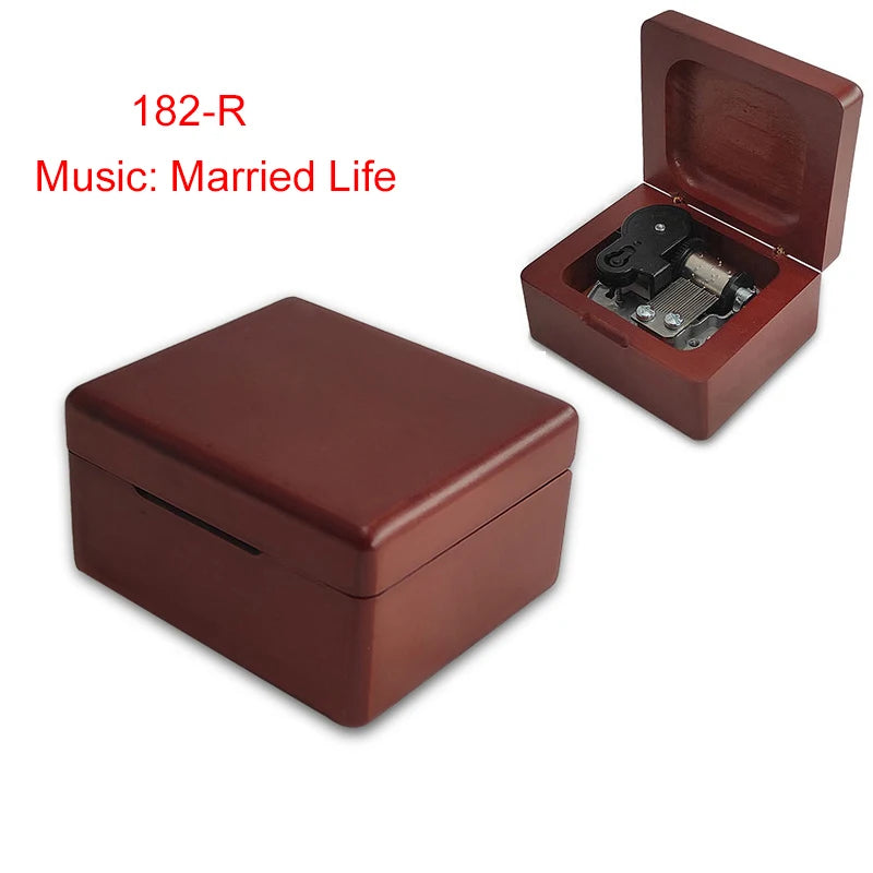 A dark brown wooden music box with an open lid revealing a mechanism.