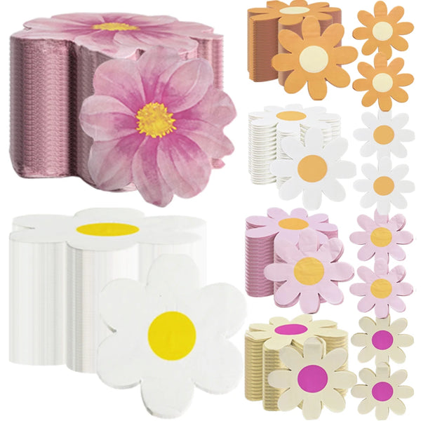 A collection of disposable pink daisy flower napkins in various shades and styles.