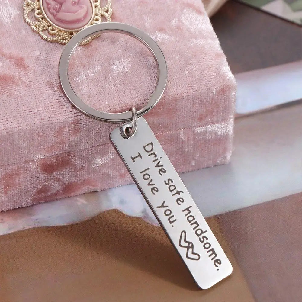 Silver stainless steel keychain with an engraved message I drive safe I love you handsome.