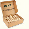 A cardboard box containing 200 pieces of wooden cutlery, including forks and spoons.