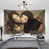 A large tapestry featuring a close-up portrait of Megan Fox in black and gold tones hanging above a bed.