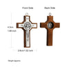 A wooden crucifix pendant with a detailed depiction of Jesus Christ on the front and a circular relief on the back.