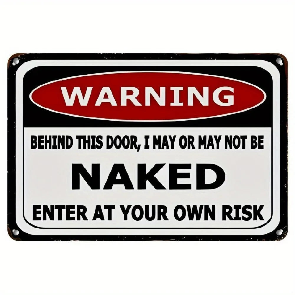 A black and white warning sign with red text that reads Behind This Door I May Or May Not Be Naked Enter At Your Own Risk