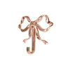 A brass bowknot wall hook used for home organization.