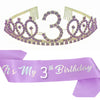 A purple tiara crown set with the number three and a matching sash for a birthday celebration.