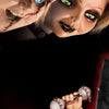 A close-up of a diamond painting kit featuring a portrait of Chucky the horror character with detailed makeup and eyes.
