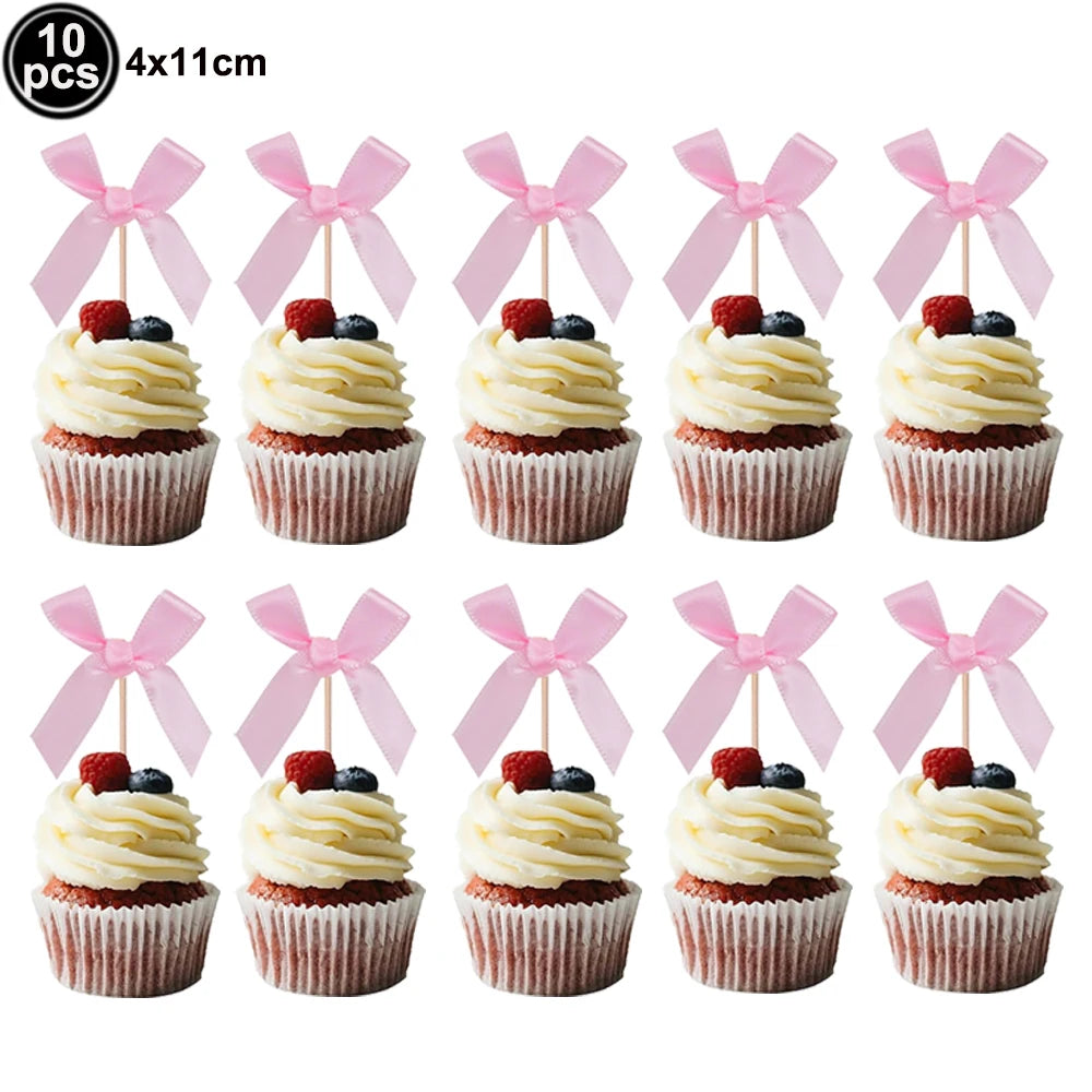 Ten pink bow themed birthday party cupcake liners and toppers.