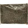 A sealed plastic bag containing dark brown black salt granules.