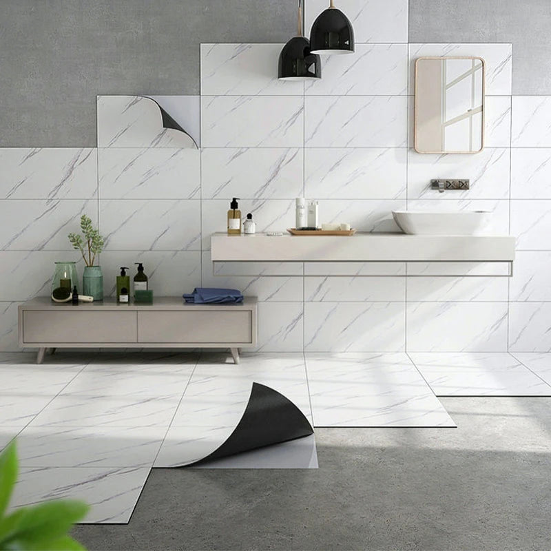 Modern bathroom or kitchen wall featuring white marble tile accents and a light gray vanity.