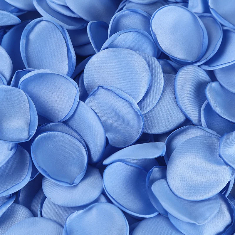 A close-up of light blue silk rose petals for weddings and events.