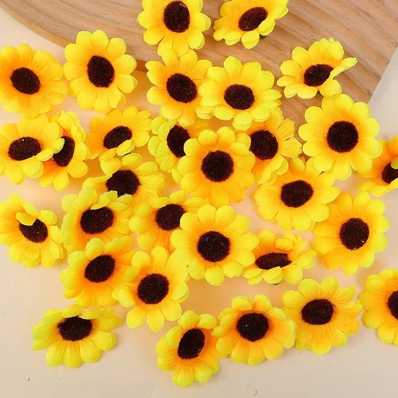 A pile of bright yellow artificial sunflower heads with dark centers.