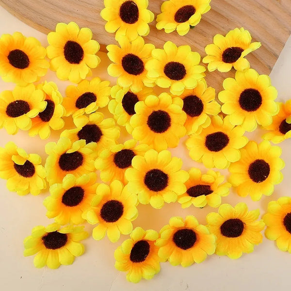 A pile of bright yellow artificial sunflower heads with dark centers.