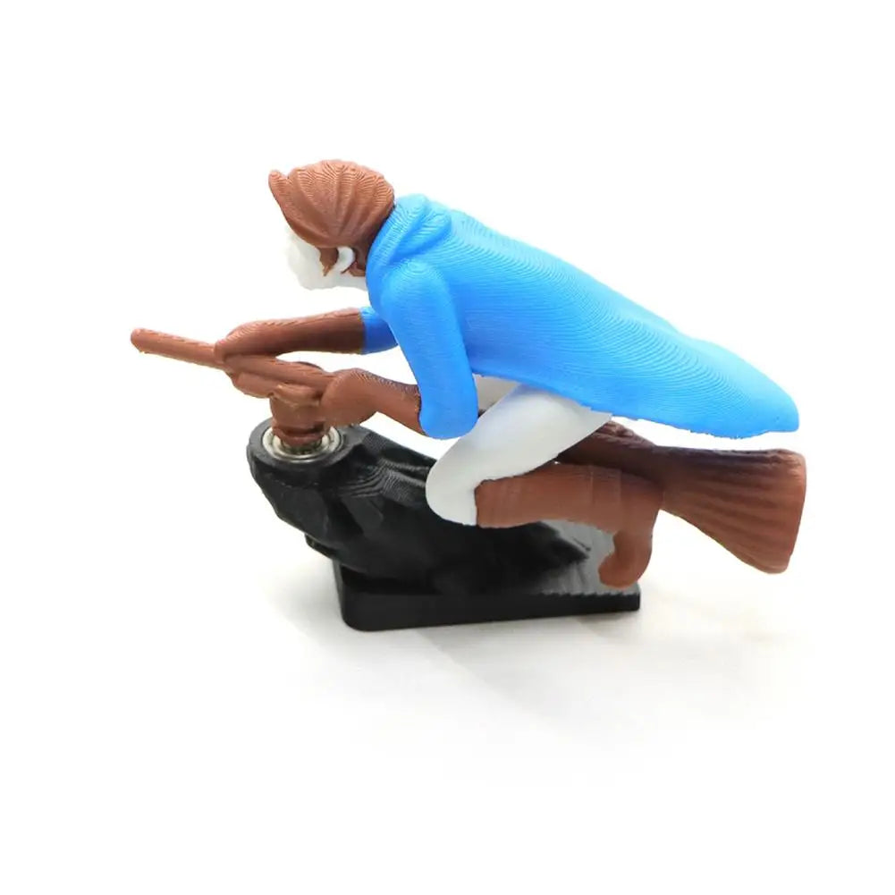 A miniature figurine of a witch and wizard flying carriage dashboard drift decor.
