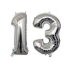 Silver foil number balloons shaped like the numbers 1 and 3 for a birthday party