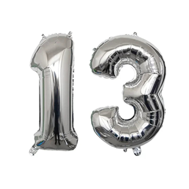 Silver foil number balloons shaped like the numbers 1 and 3 for a birthday party