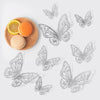 A set of 3D hollow butterfly wall stickers in gold and silver metallic decor displayed on a white background.