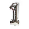 A metallic silver foil balloon shaped like the number one.