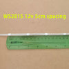 A white WS2815 LED strip is shown next to a ruler, demonstrating a 5cm spacing.