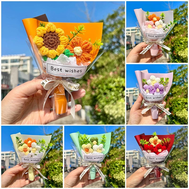 A hand holds a bouquet of handmade crochet flowers in an orange paper wrapper with a bow.